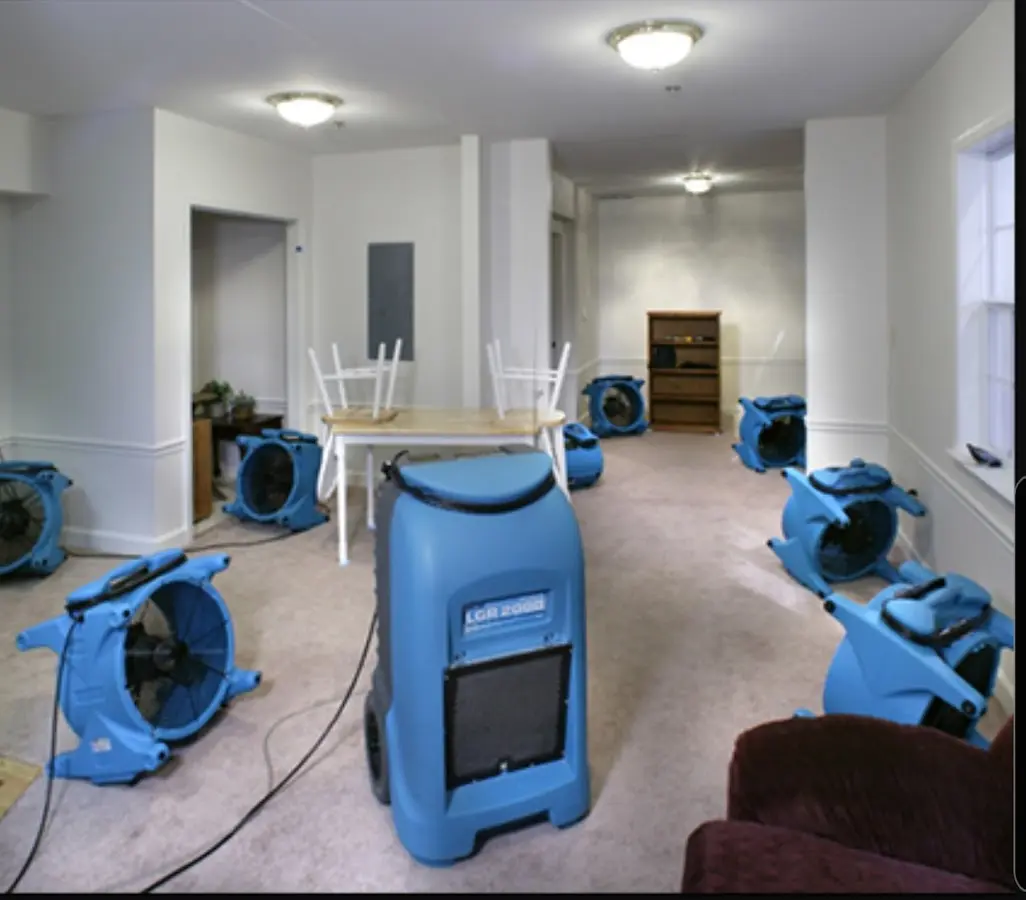 Air movers and dehumidifier setup for Water Damage Restoration in Vernon